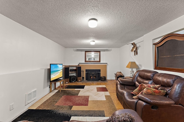 1682 Oakdale Ave W, Saint Paul, MN 55118 - living room featuring a textured ceiling and a brick fireplace