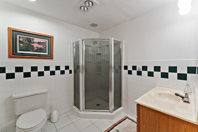 1682 Oakdale Ave W, Saint Paul, MN 55118 - bathroom featuring tile walls, vanity, tile patterned floors, a stall shower, and wainscoting