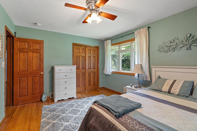 1682 Oakdale Ave W, Saint Paul, MN 55118 - bedroom featuring a closet, wood finished floors, and a ceiling fan