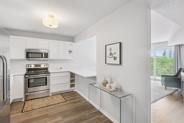 1200 Nicollet Mall Unit 523, Minneapolis, MN 55403 - kitchen with stainless steel appliances, open shelves, a textured ceiling, dark wood finished floors, and white cabinetry