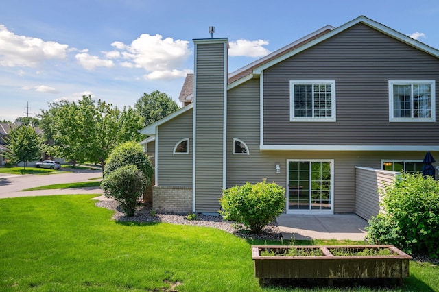 18347 Coneflower Ln, Eden Prairie, MN 55346 - back of property with a yard and a chimney