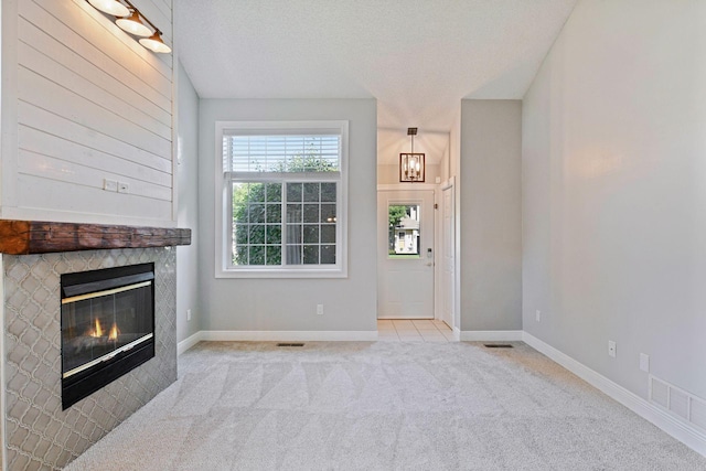 18347 Coneflower Ln, Eden Prairie, MN 55346 - unfurnished living room with carpet flooring and a glass covered fireplace