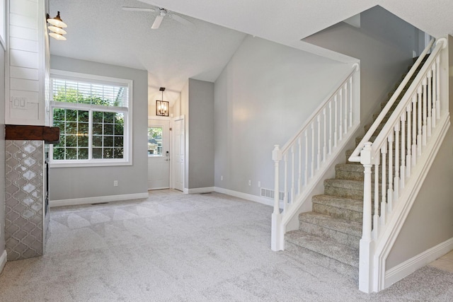 18347 Coneflower Ln, Eden Prairie, MN 55346 - entrance foyer featuring carpet floors, ceiling fan, and stairway