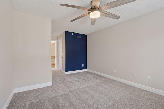 18347 Coneflower Ln, Eden Prairie, MN 55346 - spare room featuring light carpet, a ceiling fan, and a textured ceiling