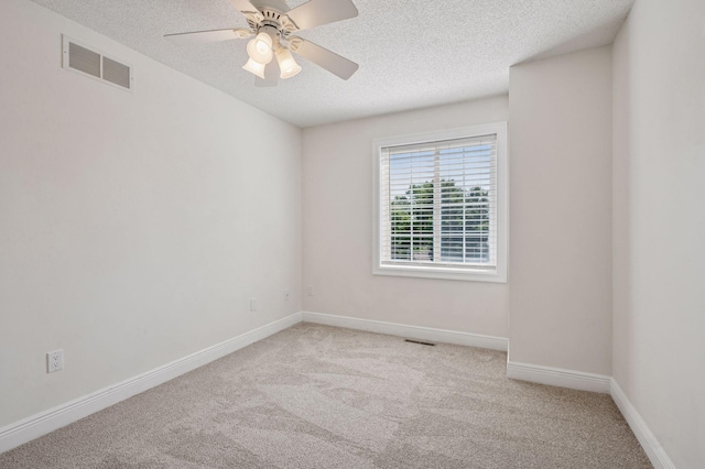 18347 Coneflower Ln, Eden Prairie, MN 55346 - empty room with a textured ceiling, carpet flooring, and a ceiling fan