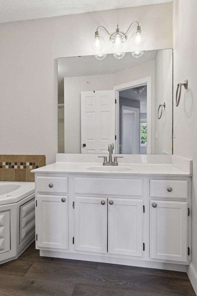 18347 Coneflower Ln, Eden Prairie, MN 55346 - full bath with vanity, a bath, and wood finished floors