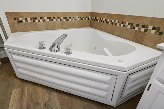 18347 Coneflower Ln, Eden Prairie, MN 55346 - bathroom with a jetted tub and wood finished floors