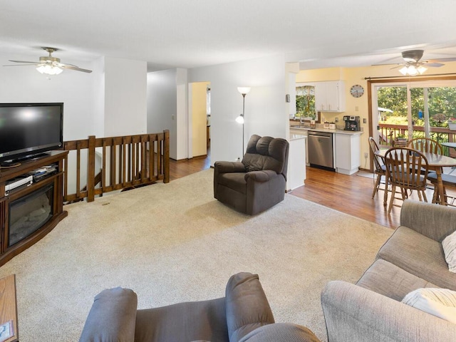 1507 234th Ln NE, Bethel, MN 55005 - living area with a ceiling fan, light carpet, and light wood finished floors