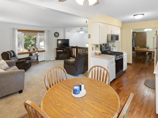 1507 234th Ln NE, Bethel, MN 55005 - dining space featuring ceiling fan and wood finished floors