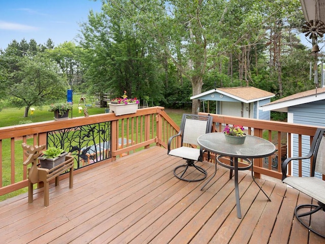 1507 234th Ln NE, Bethel, MN 55005 - wooden deck featuring an outdoor structure, a yard, and outdoor dining space