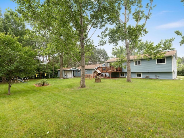 1507 234th Ln NE, Bethel, MN 55005 - view of green lawn featuring a deck and an outbuilding