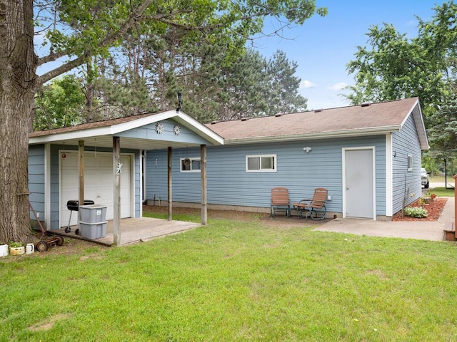 1507 234th Ln NE, Bethel, MN 55005 - rear view of property featuring a lawn and a detached garage