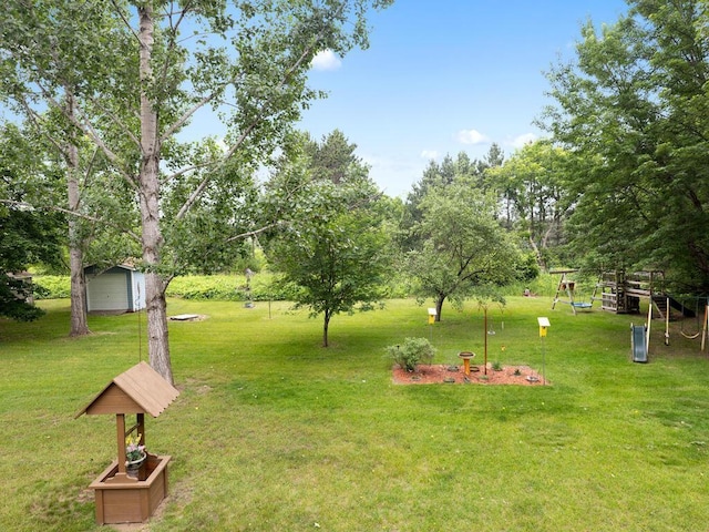 1507 234th Ln NE, Bethel, MN 55005 - view of green lawn featuring an outbuilding, view of scattered trees, and a detached garage
