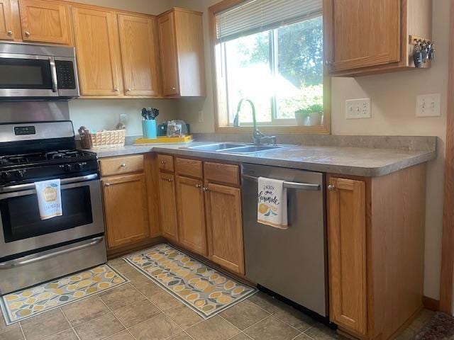 1141 5th St E, Saint Paul, MN 55106 - kitchen with stainless steel appliances and light countertops