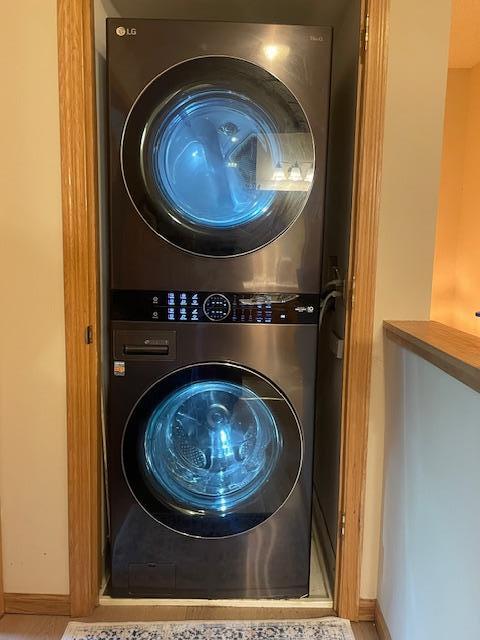 1141 5th St E, Saint Paul, MN 55106 - laundry area featuring estacked washer and dryer and baseboards