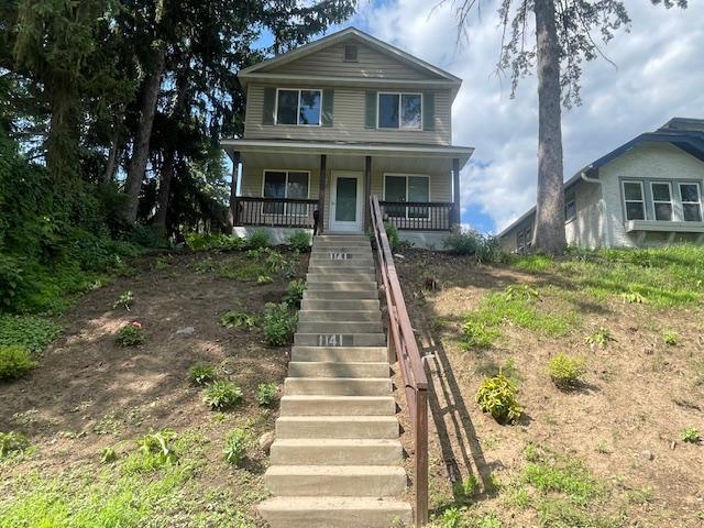 1141 5th St E, Saint Paul, MN 55106 - view of front facade with stairway and a porch