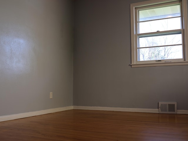 1682 Cottage Ave E, Saint Paul, MN 55106 - empty room with wood finished floors