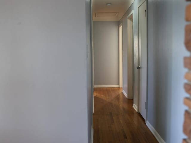 1682 Cottage Ave E, Saint Paul, MN 55106 - hall featuring dark wood-style flooring and attic access