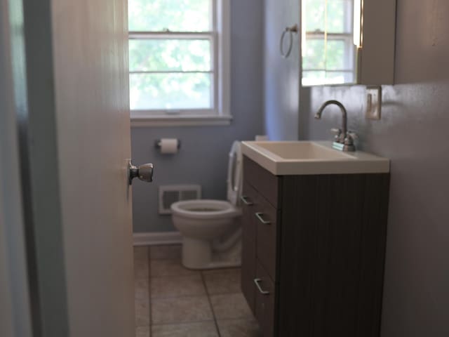 1682 Cottage Ave E, Saint Paul, MN 55106 - bathroom featuring vanity and tile patterned flooring