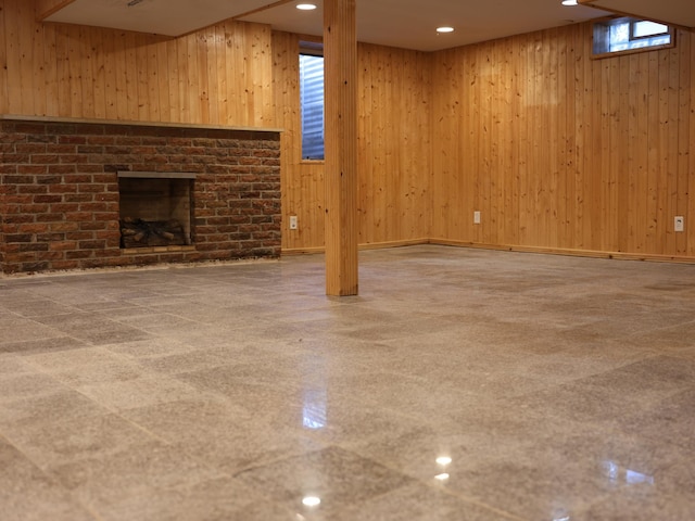 1682 Cottage Ave E, Saint Paul, MN 55106 - unfurnished living room with wooden walls, a fireplace, and recessed lighting