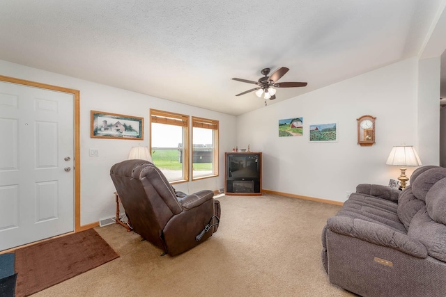 39205 436th St, Saint Peter, MN 56082 - living area featuring light colored carpet, ceiling fan, and vaulted ceiling