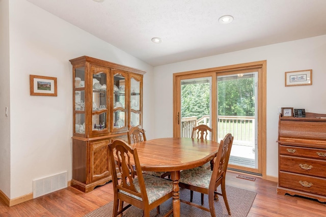 39205 436th St, Saint Peter, MN 56082 - dining room with light wood-style floors, vaulted ceiling, and recessed lighting