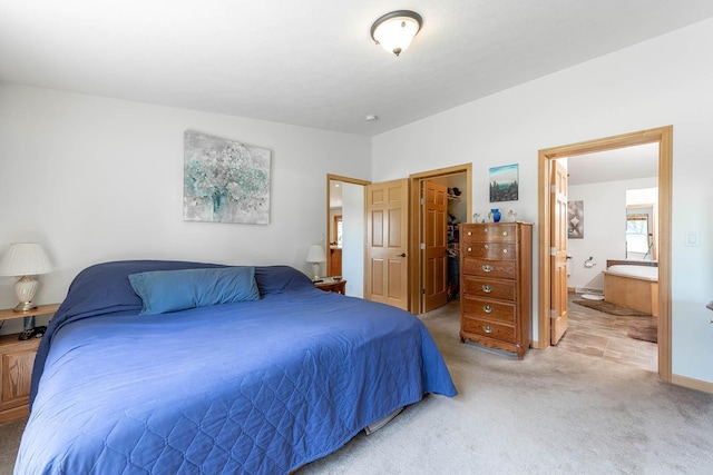 39205 436th St, Saint Peter, MN 56082 - bedroom with light colored carpet, a walk in closet, and ensuite bath