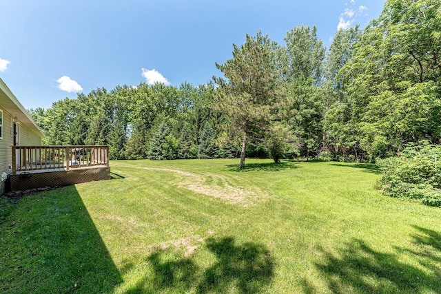39205 436th St, Saint Peter, MN 56082 - view of grassy yard featuring a deck and a view of trees