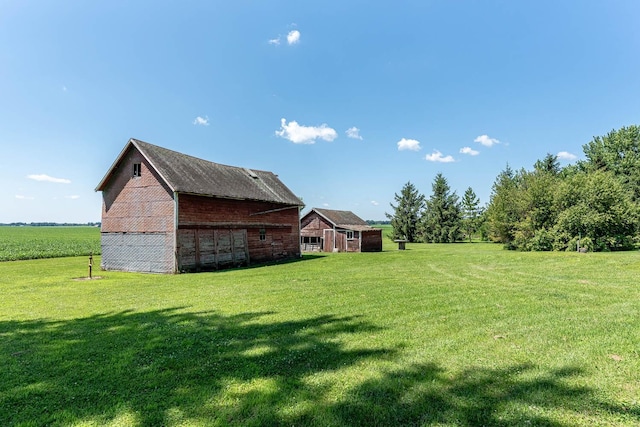 39205 436th St, Saint Peter, MN 56082 - view of green lawn featuring a barn and an outdoor structure