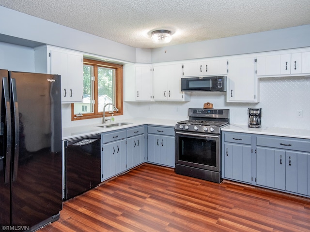 5424 Vernon Ct, Savage, MN 55378 - kitchen featuring black appliances, a textured ceiling, dark wood-style flooring, light countertops, and white cabinetry