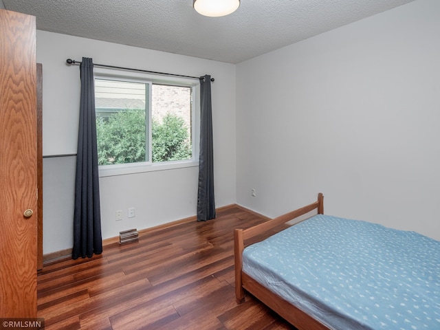 5424 Vernon Ct, Savage, MN 55378 - bedroom featuring wood finished floors and a textured ceiling