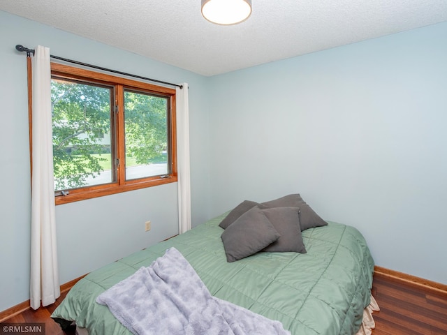 5424 Vernon Ct, Savage, MN 55378 - bedroom featuring wood finished floors and a textured ceiling