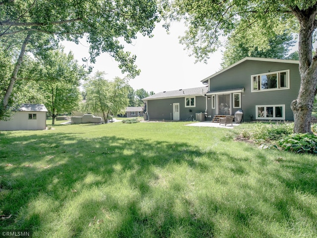 5424 Vernon Ct, Savage, MN 55378 - view of green lawn featuring a patio area