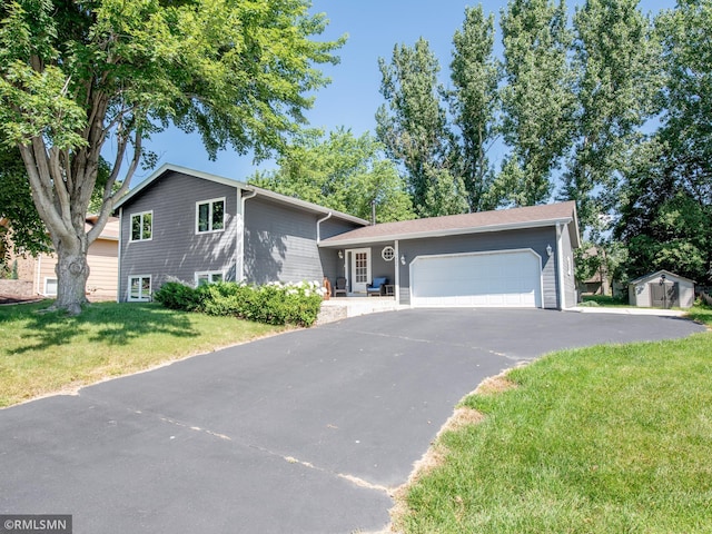 5424 Vernon Ct, Savage, MN 55378 - split level home featuring a shed, driveway, a front yard, and a garage