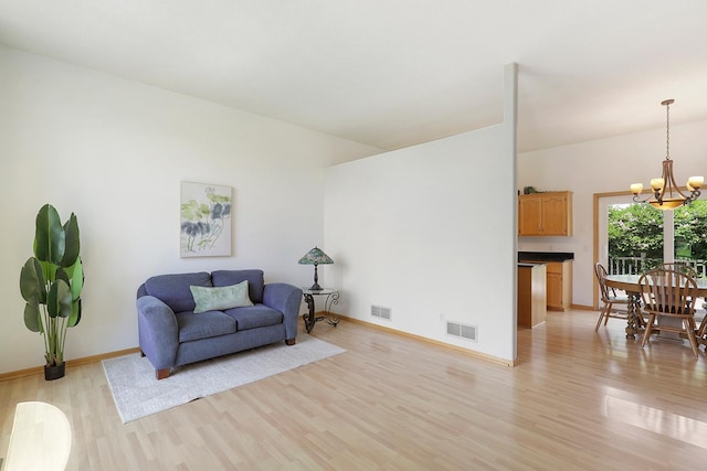 20736 196th Ave NW, Big Lake Twp, MN 55309 - living area featuring light wood-style flooring and a chandelier