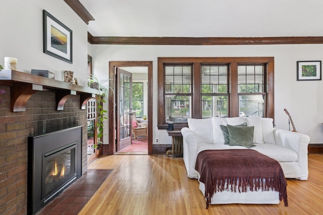 1756 Minnehaha Ave W, Saint Paul, MN 55104 - living room featuring wood finished floors, ornamental molding, a fireplace, and radiator heating unit