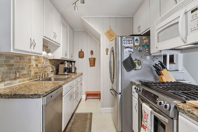 1756 Minnehaha Ave W, Saint Paul, MN 55104 - kitchen featuring stainless steel appliances, white cabinetry, decorative backsplash, light flooring, and stone countertops