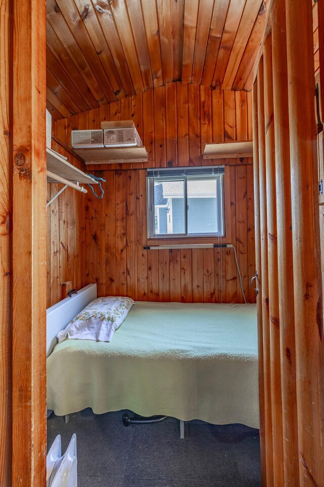 14676 Devitt Ave NW, Silver Creek Twp, MN 55362 - bedroom with wooden walls, carpet, and wooden ceiling