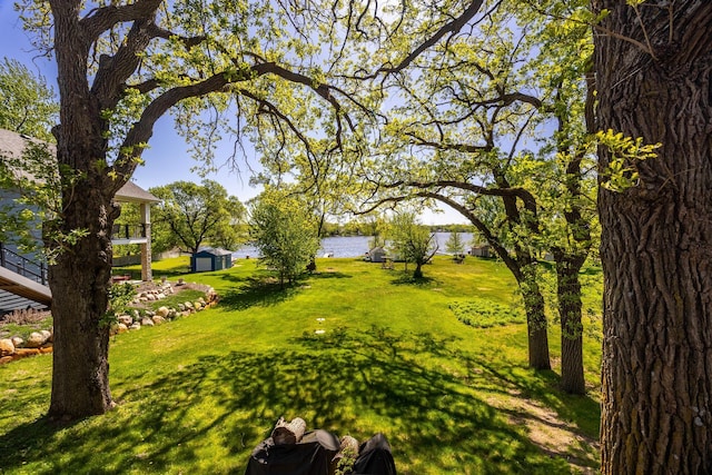 14676 Devitt Ave NW, Silver Creek Twp, MN 55362 - view of grassy yard with a shed and a water view