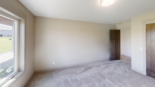 2334 9th St W, Albert Lea, MN 56007 - unfurnished bedroom with carpet floors and baseboards