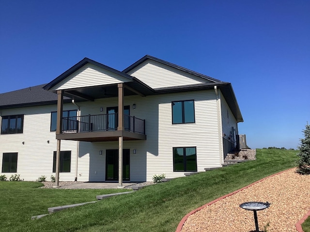 2334 9th St W, Albert Lea, MN 56007 - back of property featuring a balcony, a lawn, and a patio
