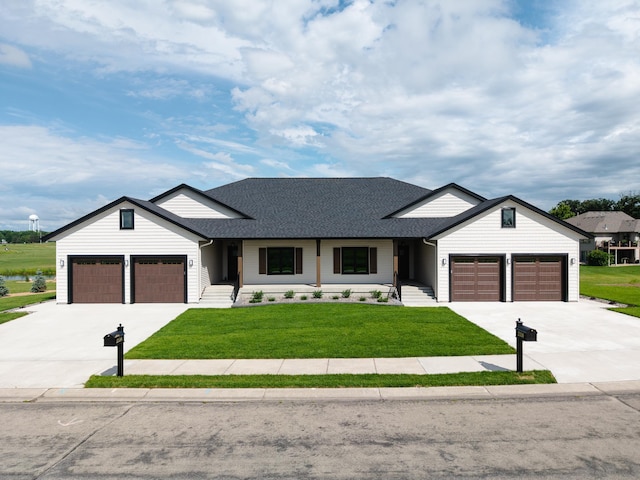 2334 9th St W, Albert Lea, MN 56007 - modern farmhouse with concrete driveway, an attached garage, a front yard, and roof with shingles