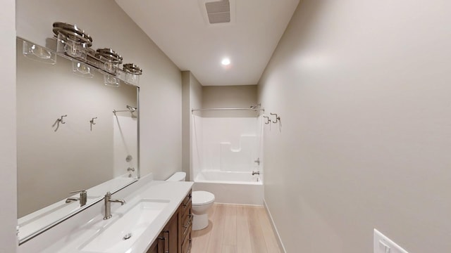 2334 9th St W, Albert Lea, MN 56007 - full bath with vanity, washtub / shower combination, and wood finished floors