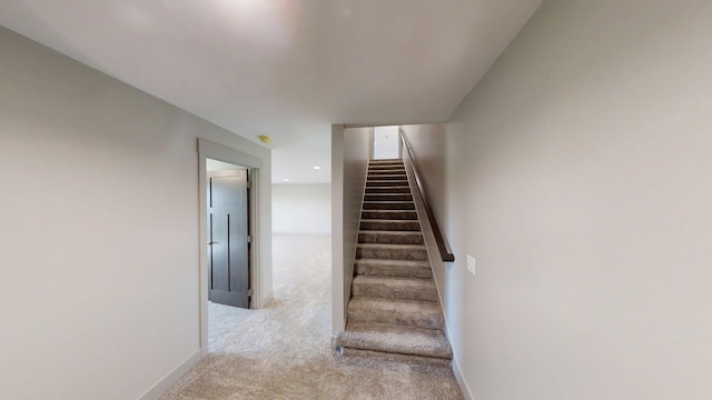 2334 9th St W, Albert Lea, MN 56007 - stairway featuring carpet floors and baseboards