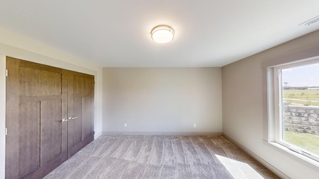 2334 9th St W, Albert Lea, MN 56007 - unfurnished bedroom with light colored carpet and a closet
