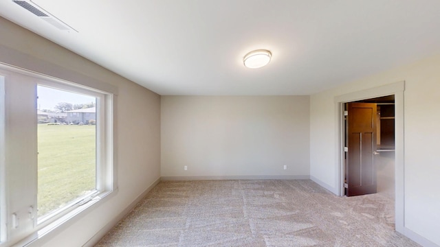2334 9th St W, Albert Lea, MN 56007 - spare room with plenty of natural light and light carpet