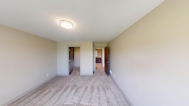 2334 9th St W, Albert Lea, MN 56007 - unfurnished bedroom with light colored carpet and baseboards