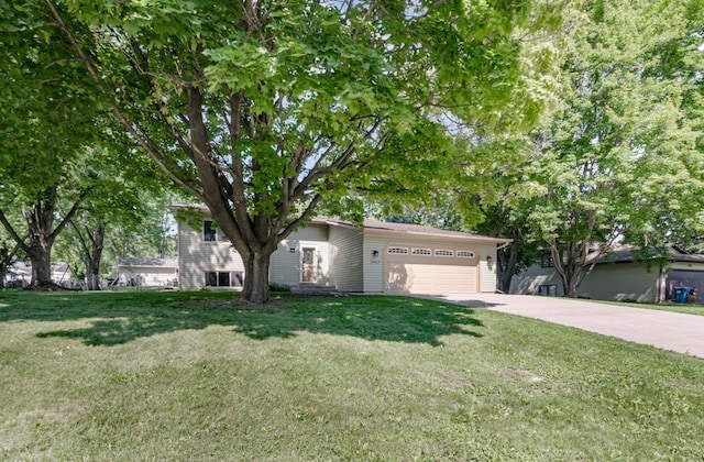 5445 Large Ave NE, Albertville, MN 55301 - view of front of home featuring a garage, concrete driveway, and a front lawn