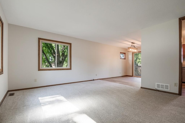 5445 Large Ave NE, Albertville, MN 55301 - unfurnished room featuring plenty of natural light and carpet floors