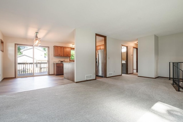 5445 Large Ave NE, Albertville, MN 55301 - unfurnished living room with light colored carpet and baseboards